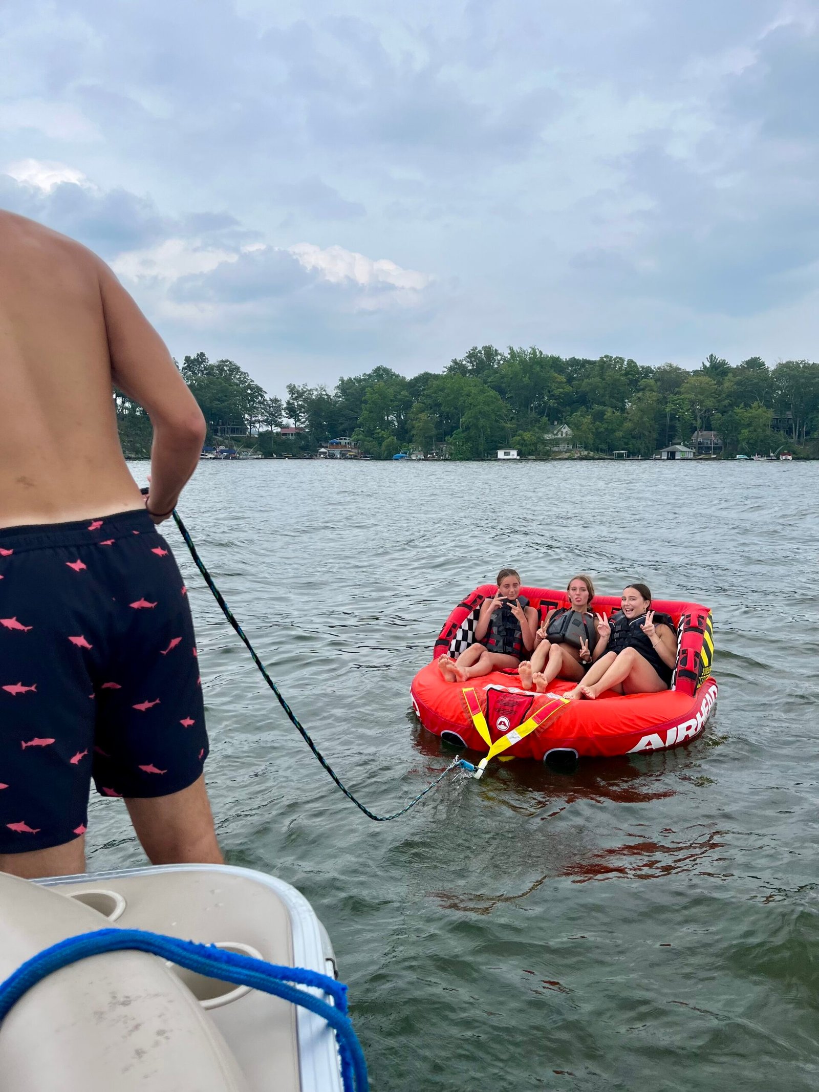 Kids ready to go tubing on the lake.