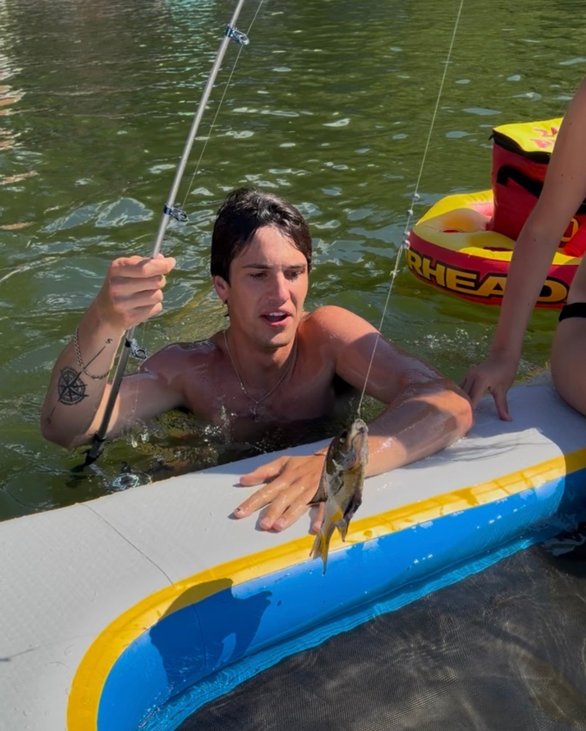 Fish being added to inflatable dock